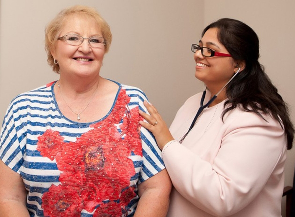 Dr Listening to Patient's Heart with Stethoscope 