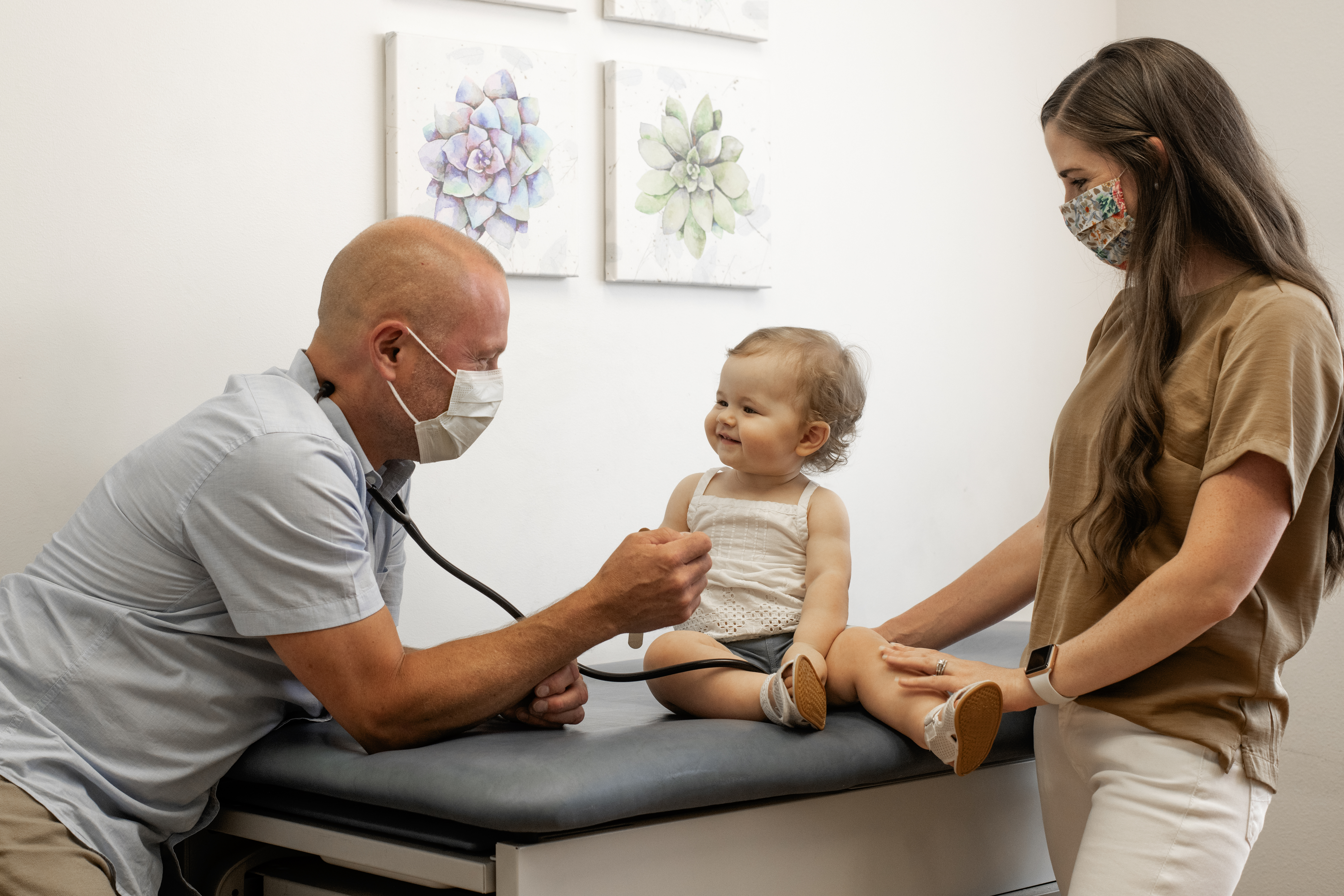 Child at Pediatrician Getting Heart Listened to with Stethoscope 
